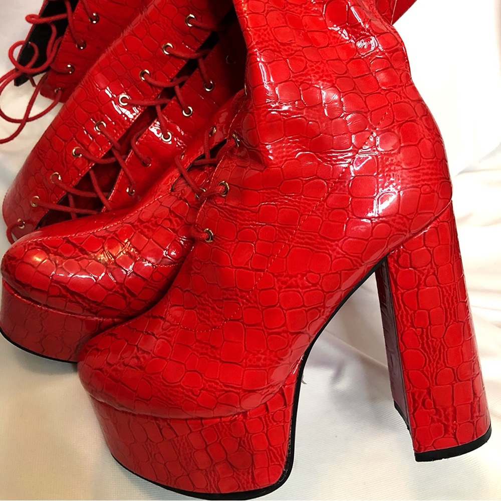 Fire red faux crocodile thigh high platform boots.